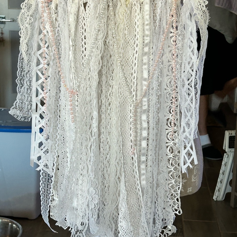 This is wall hanging. Made out of lace, pearls, & birch branch. - Picture 2 of 3